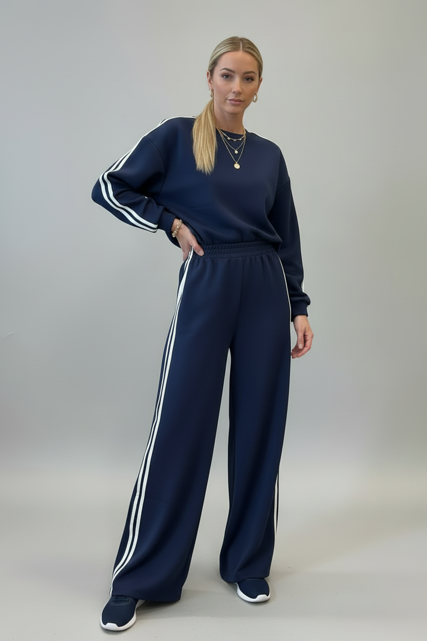 Woman wearing dirty blue varsity striped detail cropped pullover and wide leg pants outfit