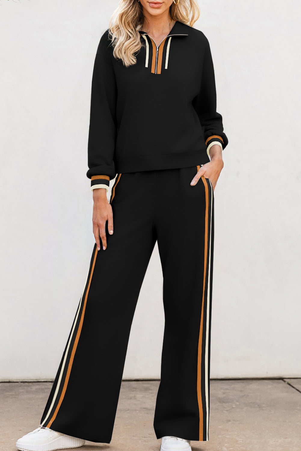 Black striped patchwork quarter zip pullover and loose pants set with orange and white stripes