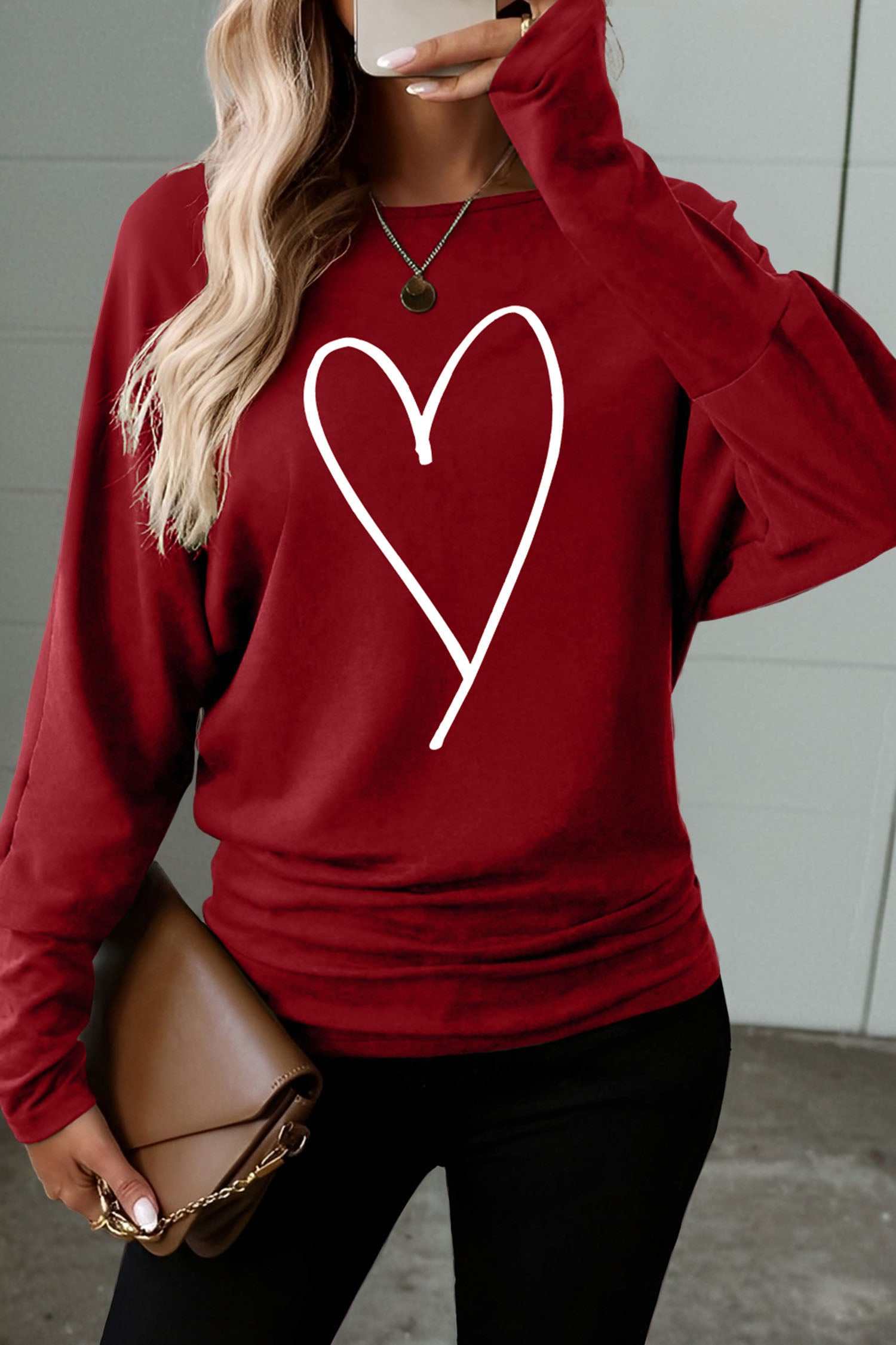 Red Dahlia heart-shaped print long sleeve top for Valentine's Day with round neck and pleated hem