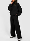 Black half zip sweatshirt and pants set made of polyester and cotton blend, featuring long sleeves and relaxed fit for casual comfort.