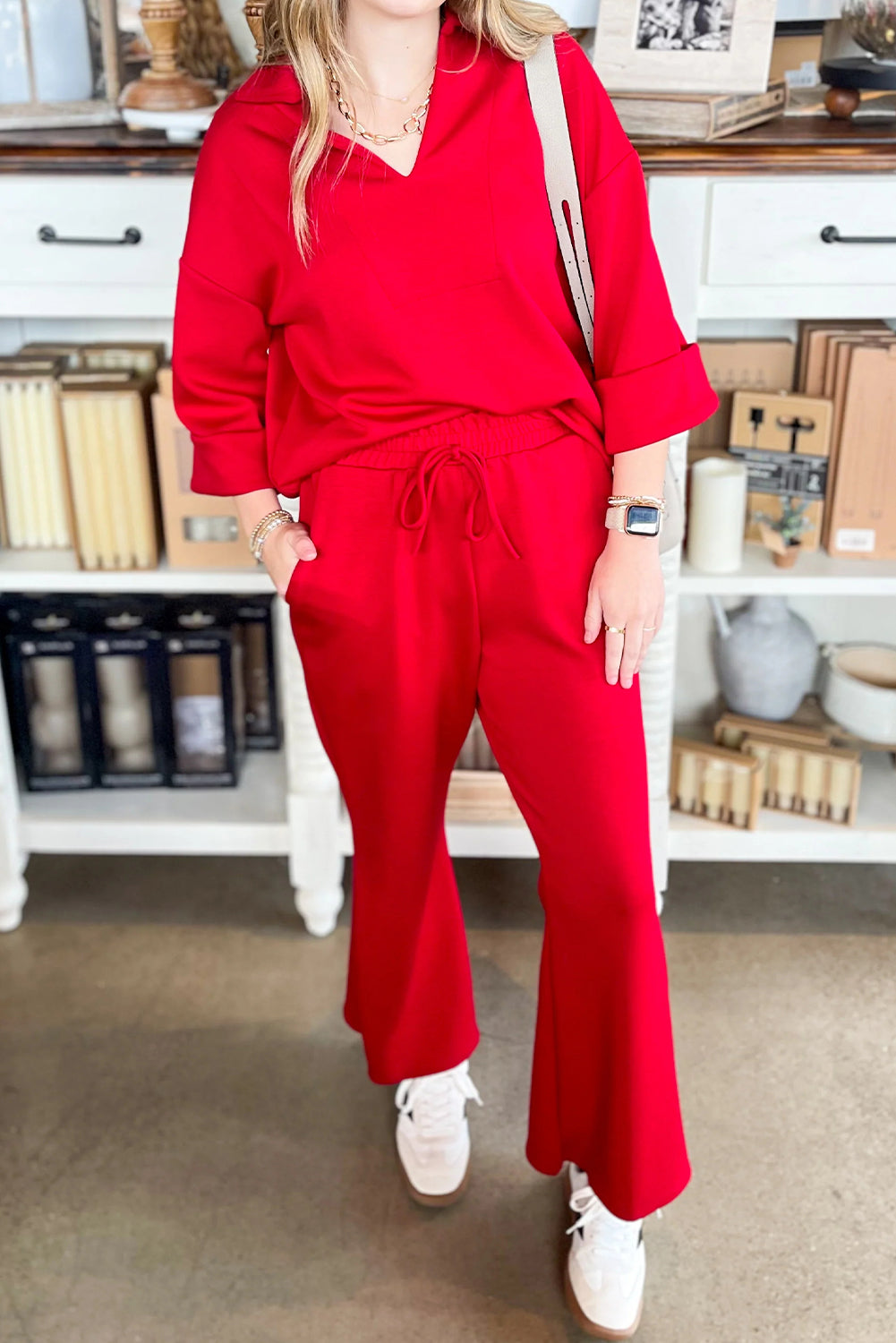 Fiery red plain V neck pullover with drawstring bell bottom pants set, soft fabric, casual style.