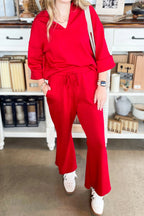 Fiery red plain V neck pullover with drawstring bell bottom pants set, soft fabric, casual style.
