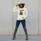 Woman wearing snake on skull hoodie with front pouch pocket and 3-panel hood in beige color