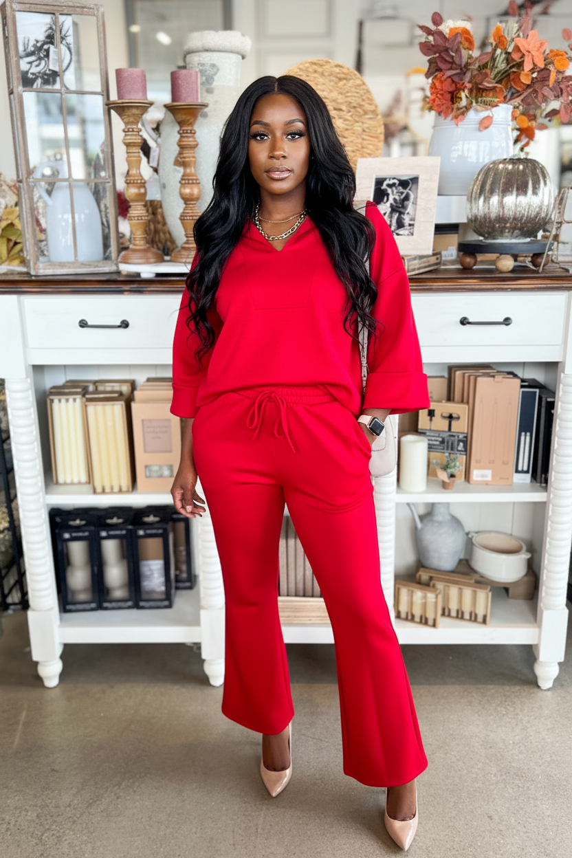 Woman wearing fiery red plain V neck pullover and drawstring bell bottom pants set with pockets