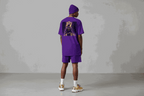 Unisex classic tee in purple featuring Kobe Bryant graphic on back, paired with matching shorts