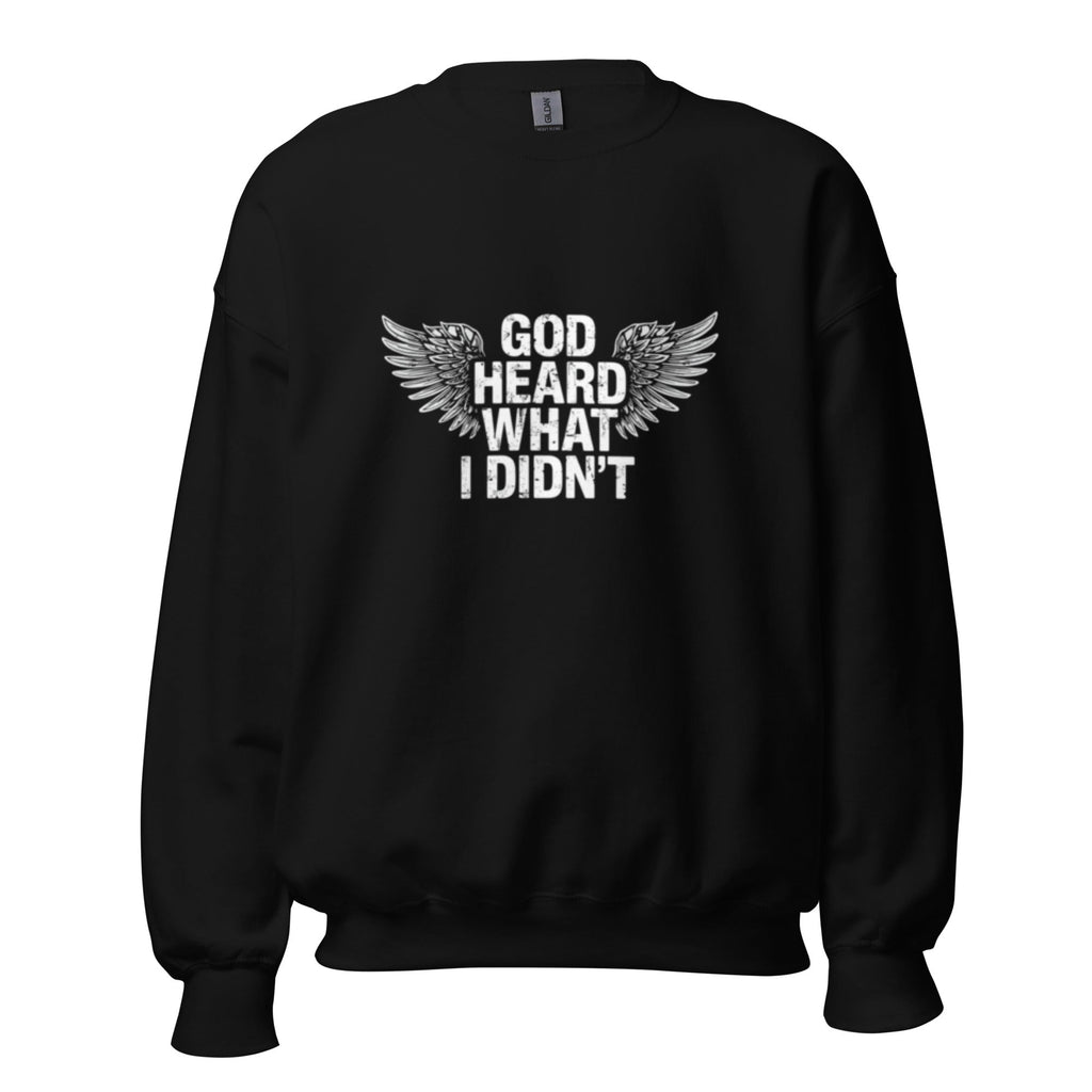 Black unisex sweatshirt with "GOD Heard What I Didn't" text and wing design, soft cotton-poly blend, classic fit.