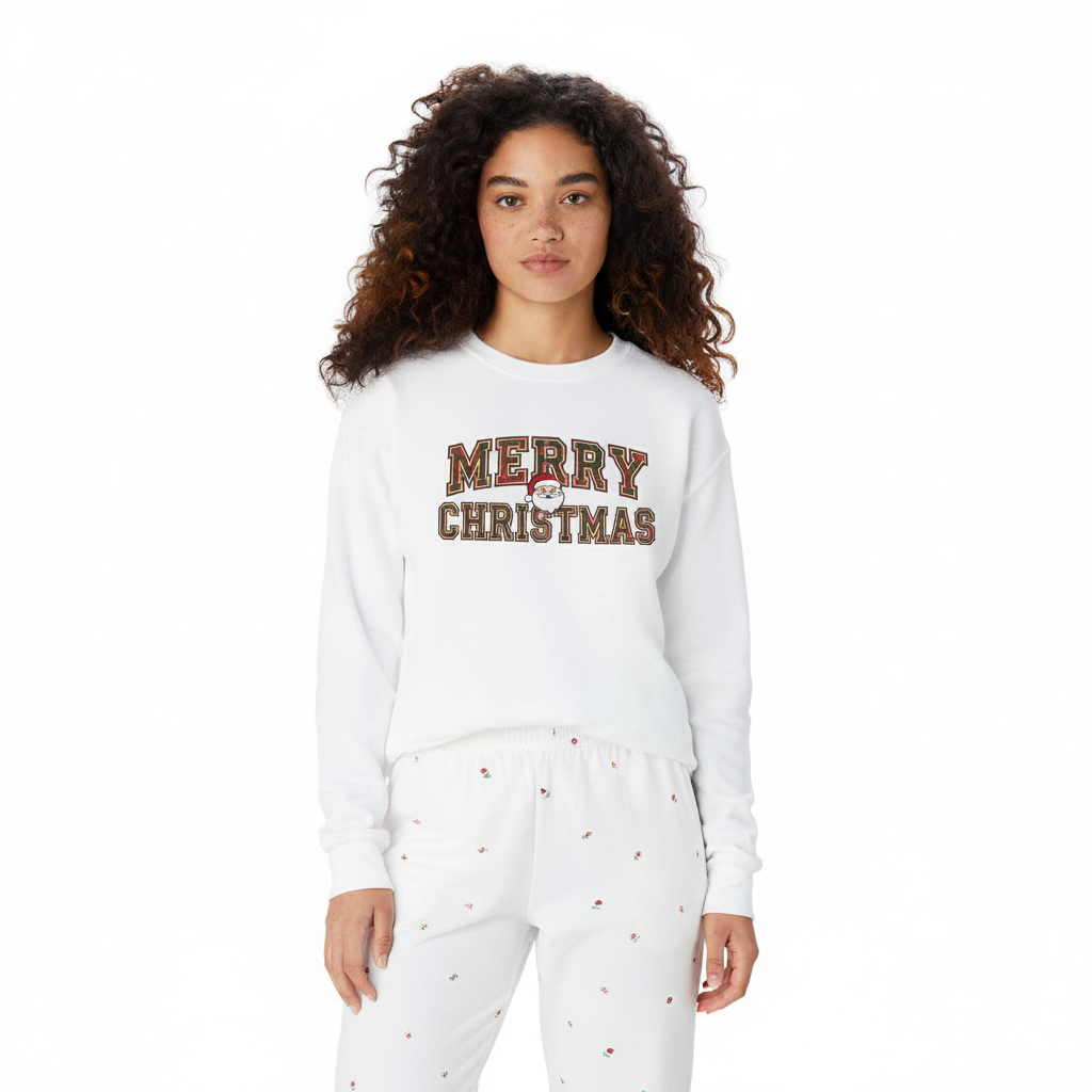 Woman wearing white Merry Christmas unisex sweatshirt and matching white pajama pants with small holiday prints