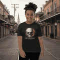 Youth wearing black Streetwear Cracked Flaming Skull short sleeve t-shirt with fiery skull graphic on urban street background
